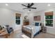 Charming bedroom featuring hardwood floors, a ceiling fan and natural light at 877 Honey Creek Rd, Mcdonough, GA 30252
