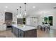 Spacious kitchen with modern appliances, center island, and an open layout to the dining room at 877 Honey Creek Rd, Mcdonough, GA 30252