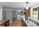 Functional kitchen with ample counter space, modern appliances, and a laundry area at 877 Honey Creek Rd, Mcdonough, GA 30252