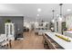 Open-concept living room showcasing hardwood floors and modern furnishings at 877 Honey Creek Rd, Mcdonough, GA 30252