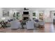 Bright and airy living room with a brick fireplace and views of the outdoors at 877 Honey Creek Rd, Mcdonough, GA 30252