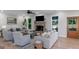 Bright and airy living room with a brick fireplace and views of the outdoors at 877 Honey Creek Rd, Mcdonough, GA 30252