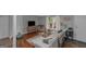 Cozy living room with stylish decor, a comfortable sofa, and hardwood flooring at 877 Honey Creek Rd, Mcdonough, GA 30252