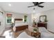 Cozy bedroom featuring a bed, nightstands, and windows with natural light at 877 Honey Creek Rd, Mcdonough, GA 30252