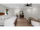 Spacious bedroom with natural light, neutral paint, and ceiling fan at 877 Honey Creek Rd, Mcdonough, GA 30252