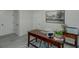 Stylish home office featuring a wooden desk, a modern painting and natural light at 877 Honey Creek Rd, Mcdonough, GA 30252