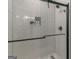 Contemporary shower with white subway tile and black hardware at 877 Honey Creek Rd, Mcdonough, GA 30252