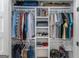 Spacious walk-in closet with multiple shelves and rods for organized storage at 877 Honey Creek Rd, Mcdonough, GA 30252