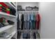 Organized walk-in closet with shelving and clothing racks providing ample storage space at 877 Honey Creek Rd, Mcdonough, GA 30252