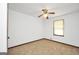 This bedroom features wall-to-wall carpeting, white walls, ceiling fan and one window at 40 Derby Country Dr, Ellenwood, GA 30294