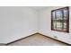 The room has wall-to-wall carpeting, white walls and one window with natural light at 40 Derby Country Dr, Ellenwood, GA 30294