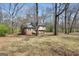 This two-story home features a blend of brick and siding, nestled in a wooded lot with mature trees at 40 Derby Country Dr, Ellenwood, GA 30294