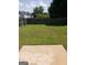 Large backyard with a fence and a concrete patio area for outdoor entertaining and relaxation at 2075 Tussahaw Xing, Mcdonough, GA 30252