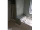 Relaxing bathroom retreat showcasing a soaking tub, neutral tile, and a separate shower, perfect for unwinding at 2075 Tussahaw Xing, Mcdonough, GA 30252