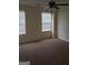 Bedroom with neutral walls, a ceiling fan, carpeted floors, and natural light from the windows at 2075 Tussahaw Xing, Mcdonough, GA 30252