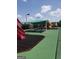 A colorful community playground with shade, picnic tables, and play equipment for children at 2075 Tussahaw Xing, Mcdonough, GA 30252