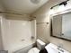 Clean bathroom featuring a shower-tub combo, neutral walls, and a modern vanity at 25 Stoneway Dr, Villa Rica, GA 30180