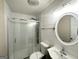 Updated bathroom with shower, new fixtures, and an oval mirror at 25 Stoneway Dr, Villa Rica, GA 30180