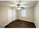 Neutral bedroom with hardwood floors, closet, and ceiling fan at 25 Stoneway Dr, Villa Rica, GA 30180