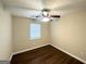 Cozy bedroom featuring hardwood floors, a ceiling fan, and a window with blinds at 25 Stoneway Dr, Villa Rica, GA 30180