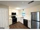 Modern kitchen featuring white cabinetry, subway tile backsplash, and stainless steel appliances at 25 Stoneway Dr, Villa Rica, GA 30180