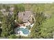 Aerial view of the home and the large private lot with mature trees surrounding the property at 113 Regents Sq, Peachtree City, GA 30269