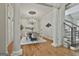 Bright dining room features hardwood floors, a chandelier, and large columns with easy access to the stairs at 113 Regents Sq, Peachtree City, GA 30269
