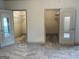 Carpeted bedroom area showing access to two closets with mirrored doors at 232 Darwish Dr, Mcdonough, GA 30252