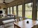 Bright dining area featuring large windows with scenic views and comfortable seating at 232 Darwish Dr, Mcdonough, GA 30252