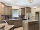 Charming kitchen featuring modern appliances, a center island, and ample counter space, perfect for culinary enthusiasts at 232 Darwish Dr, Mcdonough, GA 30252