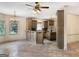 Open concept kitchen with a bar and tile flooring, ideal for entertaining and casual dining at 232 Darwish Dr, Mcdonough, GA 30252