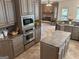 Spacious kitchen featuring stainless steel appliances, ample cabinetry, and an open layout for seamless entertaining at 232 Darwish Dr, Mcdonough, GA 30252