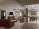 Spacious open-concept living and dining area with neutral furniture, fireplace, and lots of natural light at 232 Darwish Dr, Mcdonough, GA 30252