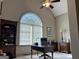 Office space with built-in shelving, a large arched window, and a traditional desk setup at 232 Darwish Dr, Mcdonough, GA 30252