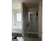 Bathroom with soaking tub, tiled floor, and a separate glass-enclosed shower at 11909 Lovejoy Crossing Blvd, Hampton, GA 30228