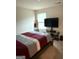 Bedroom featuring a cozy bed, TV, and natural light at 11909 Lovejoy Crossing Blvd, Hampton, GA 30228