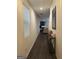 Inviting hallway featuring dark wood floors and a modern console table at 11909 Lovejoy Crossing Blvd, Hampton, GA 30228