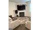 Cozy living room features a sleek fireplace and plush seating arrangements at 11909 Lovejoy Crossing Blvd, Hampton, GA 30228