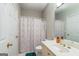 Bright, clean bathroom with neutral colors, a shower, and a white vanity for a relaxing space at 2693 Blairsden Nw Pl, Kennesaw, GA 30144