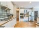 A spacious kitchen featuring custom cabinetry, stainless steel appliances, and hardwood floors for the home chef at 2693 Blairsden Nw Pl, Kennesaw, GA 30144
