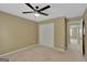 Neutral bedroom features a ceiling fan, carpet, and closet at 340 Aster Ridge Trl, Peachtree City, GA 30269