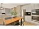 Bright kitchen featuring stainless steel appliances, white cabinetry, and a butcher block island with a breakfast bar at 340 Aster Ridge Trl, Peachtree City, GA 30269