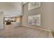 Spacious living area with high ceilings and large windows that offer plenty of natural light at 340 Aster Ridge Trl, Peachtree City, GA 30269