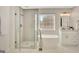 Elegant bathroom featuring a modern tub, glass shower, and vanity with marble countertop at 340 Aster Ridge Trl, Peachtree City, GA 30269
