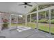 Large screened porch with ceiling fan, perfect for enjoying the outdoors at 340 Aster Ridge Trl, Peachtree City, GA 30269