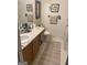 Bathroom with vanity, sink, toilet, and neutral finishes at 248 Fern Ct, Hampton, GA 30228