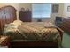 Comfortable bedroom featuring wooden dresser and cozy quilt at 248 Fern Ct, Hampton, GA 30228