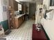 Galley kitchen with white countertop, cabinetry, and contrasting flooring at 248 Fern Ct, Hampton, GA 30228