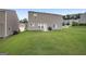 Well-maintained backyard with lawn and a patio, perfect for outdoor activities at 1560 Avalon Creek Rd, Sugar Hill, GA 30518