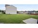 Large backyard with green grass, landscaping, and fence at 1560 Avalon Creek Rd, Sugar Hill, GA 30518